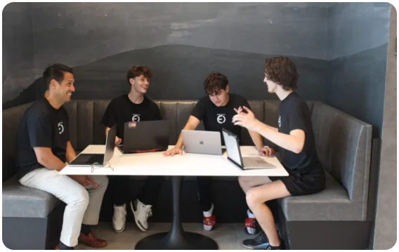 The Expert Overflow team working together around a table.